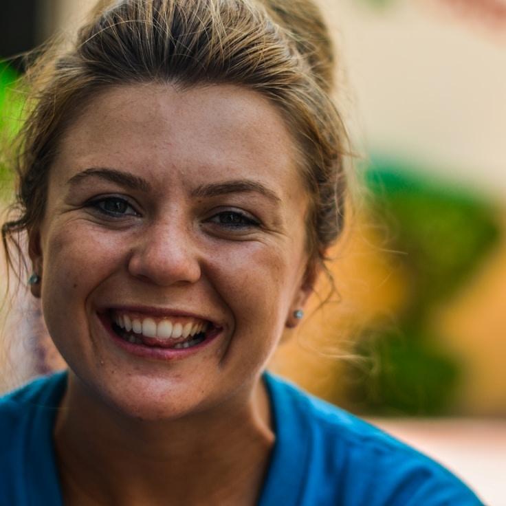 Kaveri Mehta, Lead Design Curator at AstriVerticora, reviewing corporate floral arrangements